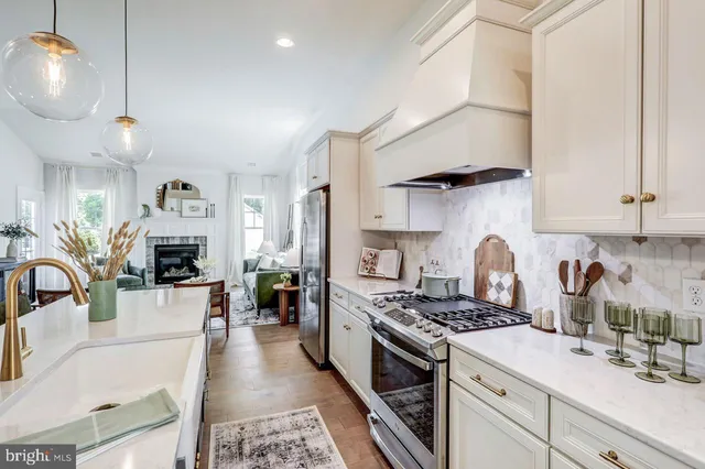 a kitchen with stove and cabinets