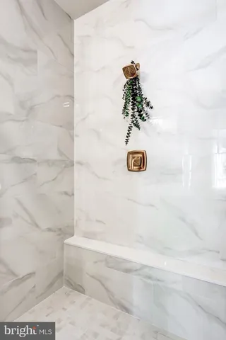 a bath tub sitting next to a white sink