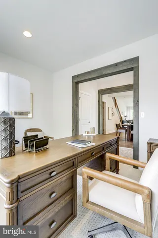 a view of kitchen with sink and natural light
