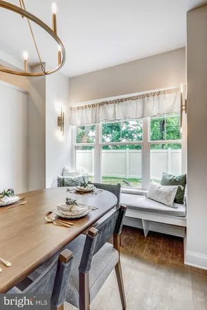 a dining room with furniture and window
