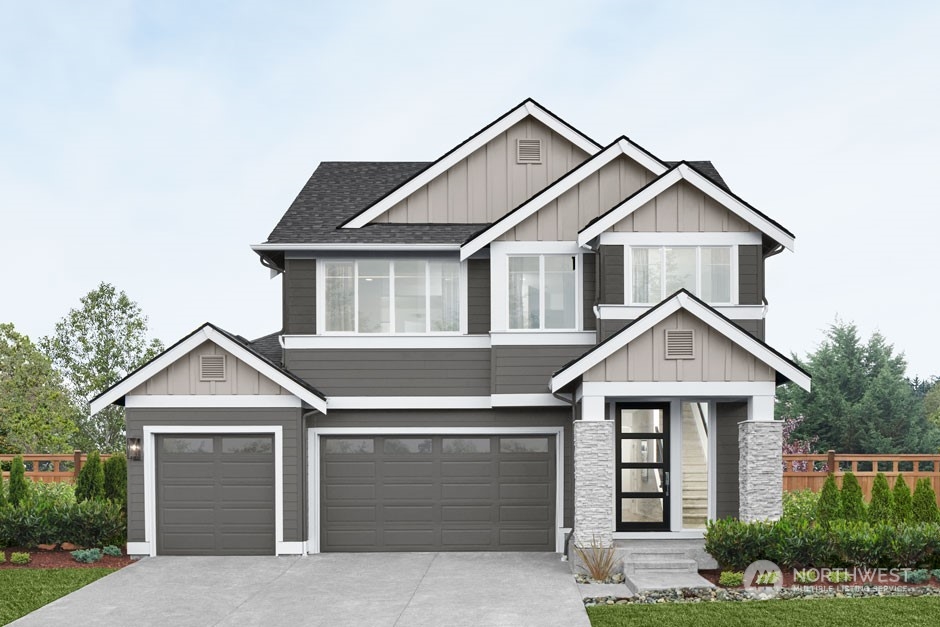 2131 Northeast 14th Place Renton, WA 98056 - Photo 1 of 11 a front view of a house with yard and trees