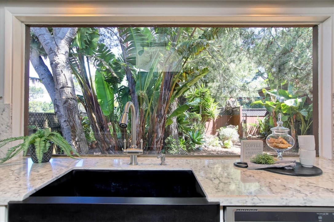 798 Drake Street Cambria, CA 93428 - Photo 15 of 45 a view of a sink and a dining room with a table and chairs