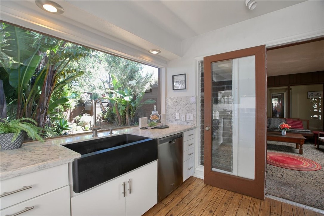 798 Drake Street Cambria, CA 93428 - Photo 16 of 45 a kitchen with stainless steel appliances granite countertop a sink and wooden cabinets