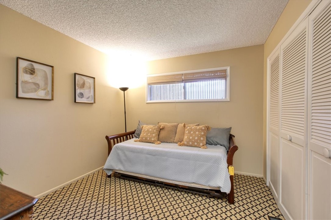 798 Drake Street Cambria, CA 93428 - Photo 28 of 45 a bedroom with a bed and a window