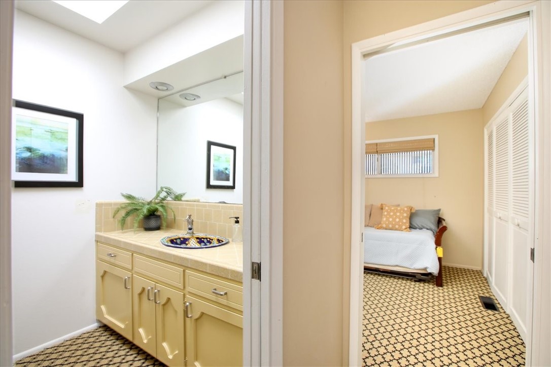 798 Drake Street Cambria, CA 93428 - Photo 30 of 45 a bathroom with a sink and a mirror