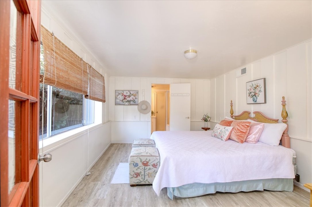 798 Drake Street Cambria, CA 93428 - Photo 36 of 45 a bedroom with a bed and a large window