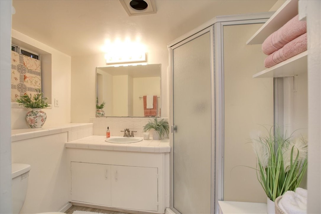 798 Drake Street Cambria, CA 93428 - Photo 38 of 45 a bathroom with a sink a mirror and a shower