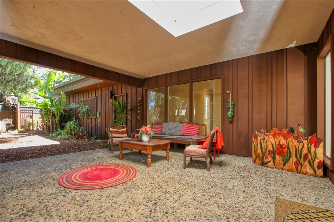 798 Drake Street Cambria, CA 93428 - Photo 4 of 45 a living room with furniture a rug and a large window