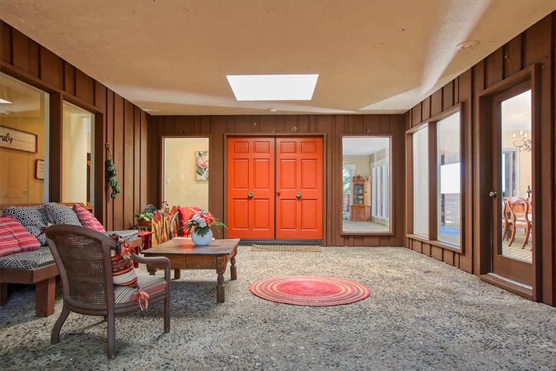 798 Drake Street Cambria, CA 93428 - Photo 5 of 45 a living room with furniture and large windows