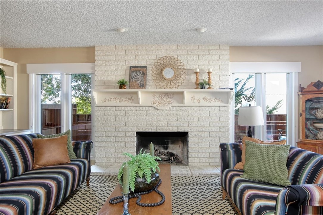 798 Drake Street Cambria, CA 93428 - Photo 8 of 45 a living room with furniture and a fireplace