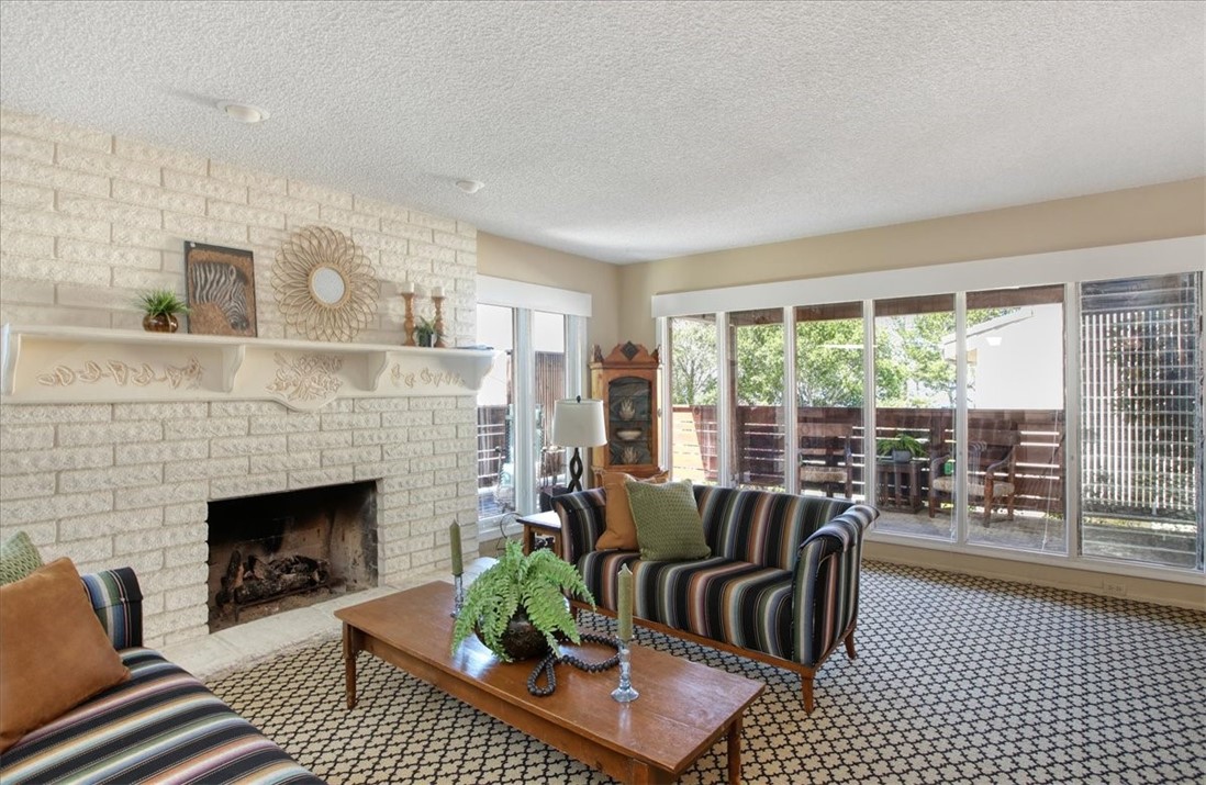 798 Drake Street Cambria, CA 93428 - Photo 9 of 45 a living room with furniture large window and a fireplace