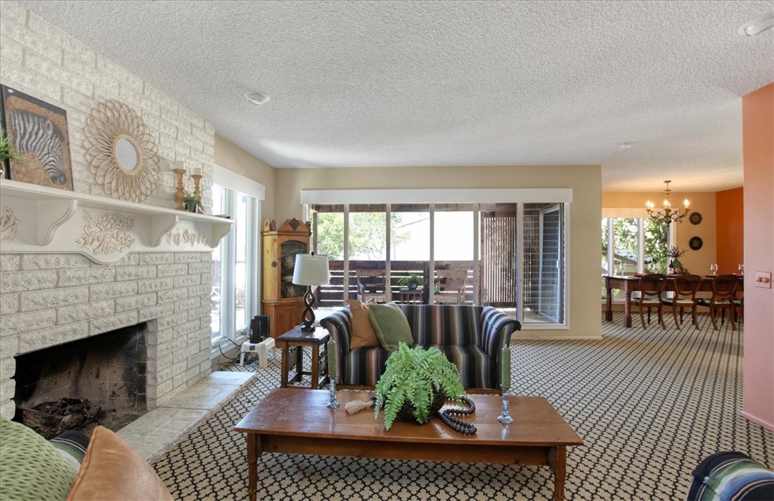 798 Drake Street Cambria, CA 93428 - Photo 10 of 45 a living room with furniture large window and a fireplace