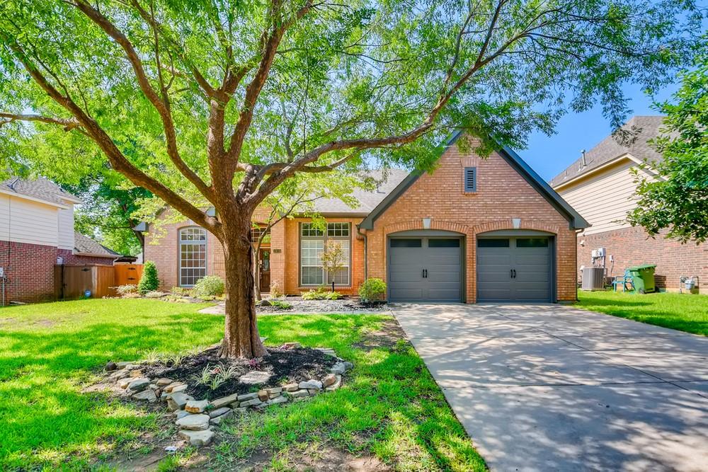 1919 Stafford Road Grapevine, TX 76051 - Photo 1 of 1 a front view of a house with a yard and garage