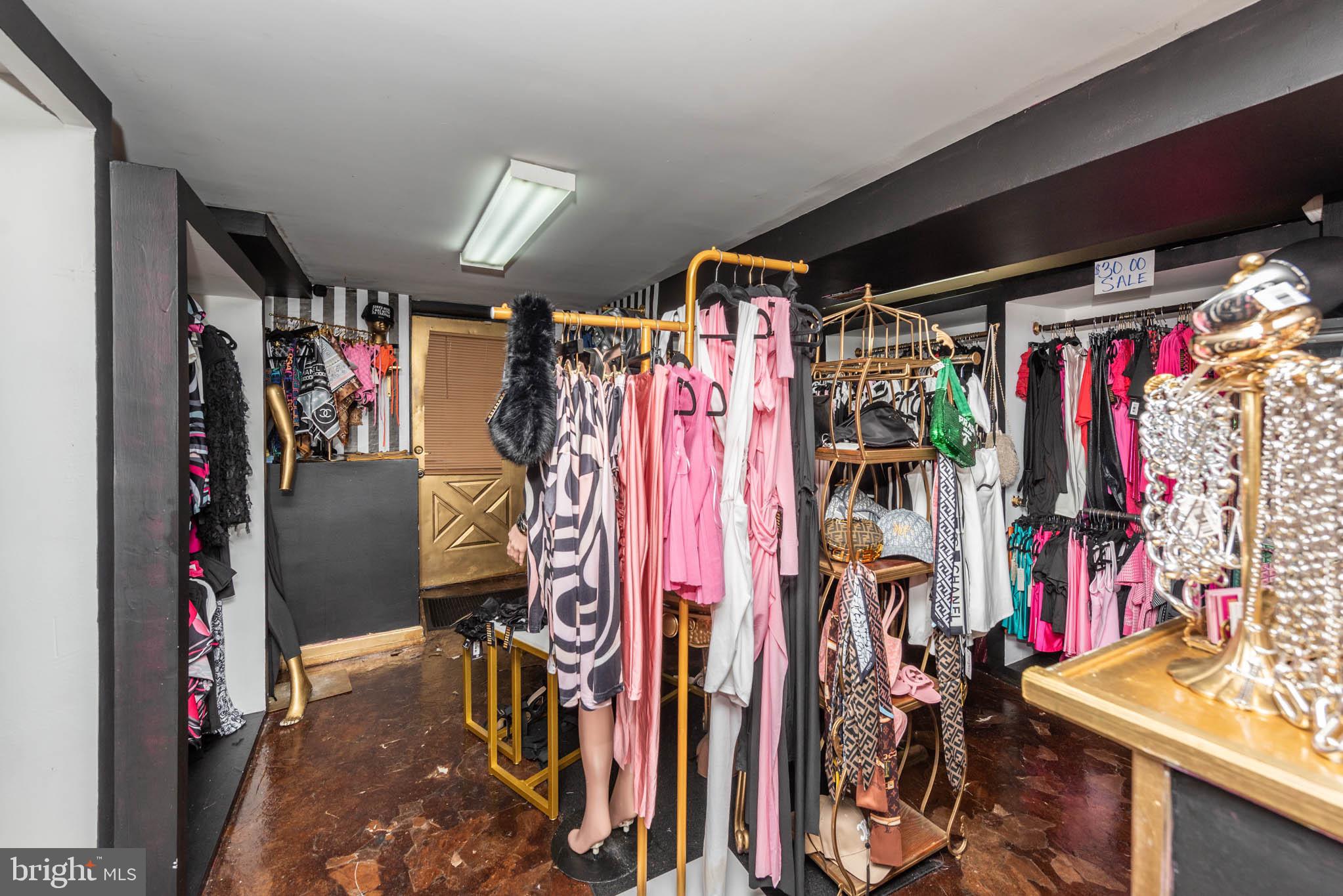 7231 Harford Road Baltimore, MD 21234 - Photo 18 of 21 a view of walk in closet with clothes