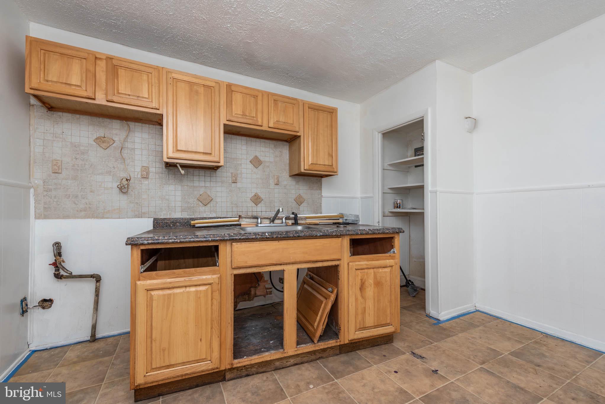 7231 Harford Road Baltimore, MD 21234 - Photo 9 of 21 a kitchen with stainless steel appliances granite countertop a stove and a sink
