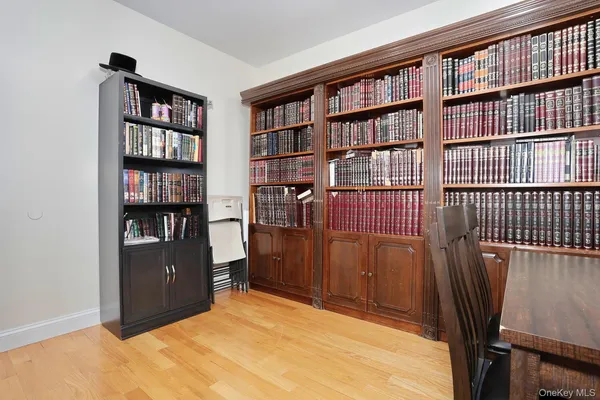 a view of an empty room with furniture