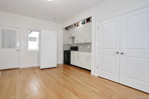 a view of kitchen with wooden floor and window