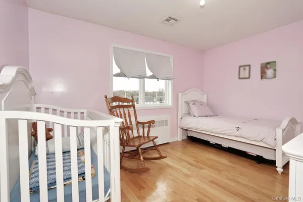 a bedroom with furniture and a window