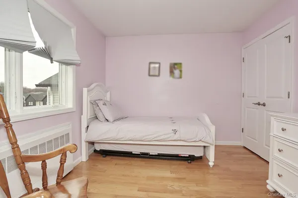 a bathroom with a bathtub and a window