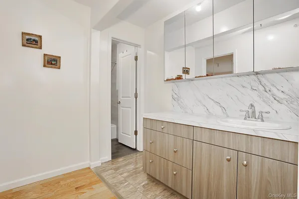 a bathroom with a sink and a mirror