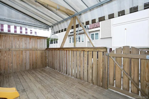 a view of balcony with wooden floor