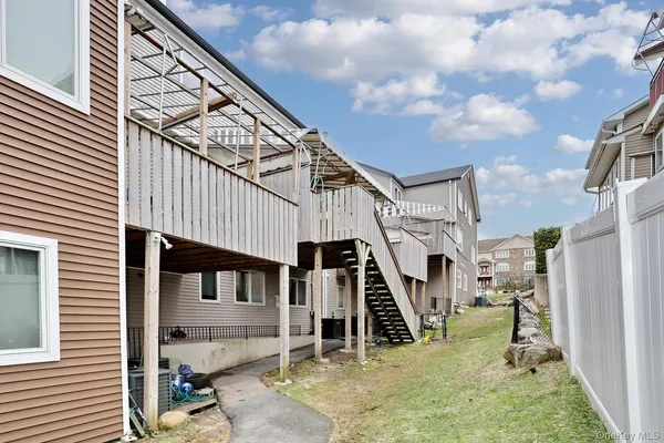 a view of a house with wooden stairs