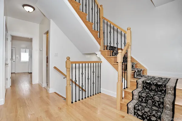 a view of entryway with wooden floor