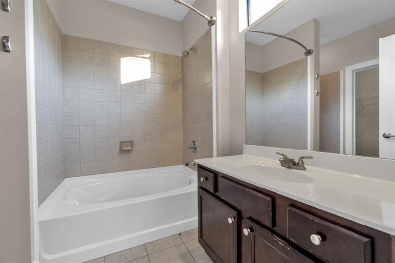 2230 Cheshire Bridge Road Northeast, Unit 412 Atlanta, GA 30324 - Photo 13 of 35 a bathroom with a sink and a bathtub