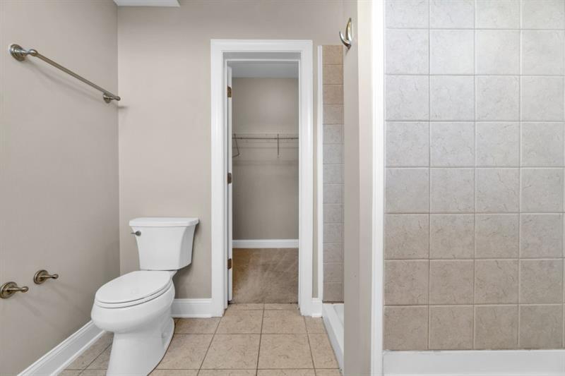 2230 Cheshire Bridge Road Northeast, Unit 412 Atlanta, GA 30324 - Photo 14 of 35 a bathroom with a toilet and a shower