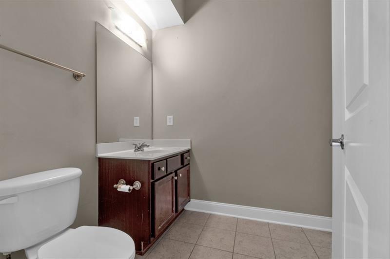 2230 Cheshire Bridge Road Northeast, Unit 412 Atlanta, GA 30324 - Photo 19 of 35 a bathroom with a sink toilet and shower