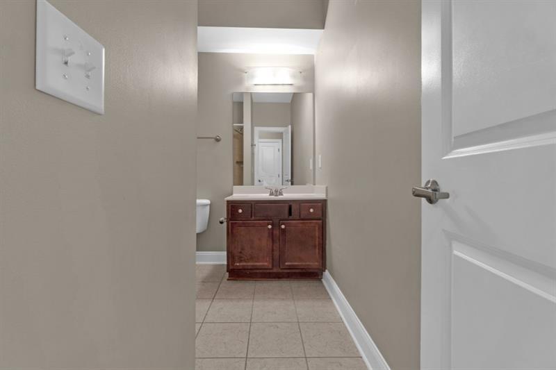2230 Cheshire Bridge Road Northeast, Unit 412 Atlanta, GA 30324 - Photo 20 of 35 a bathroom with a sink and a mirror