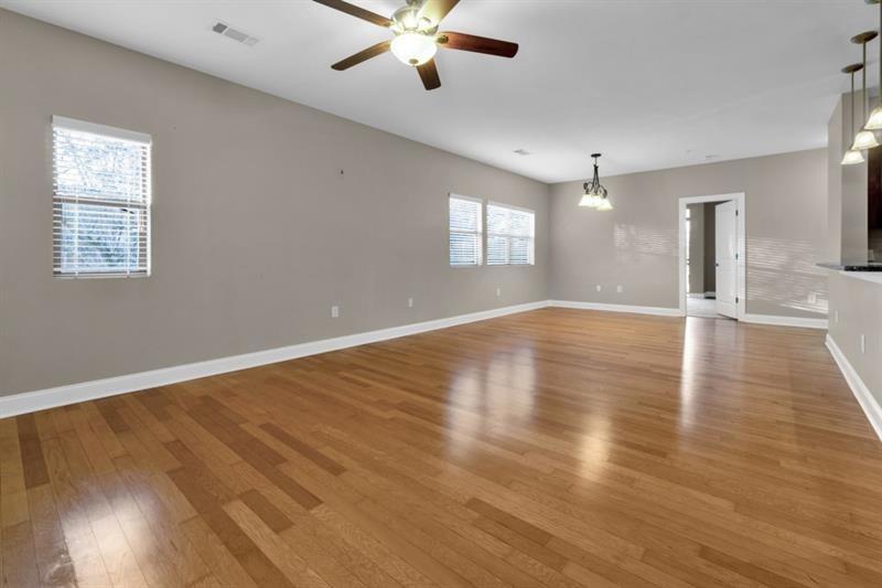2230 Cheshire Bridge Road Northeast, Unit 412 Atlanta, GA 30324 - Photo 6 of 35 a view of an empty room with wooden floor and a window