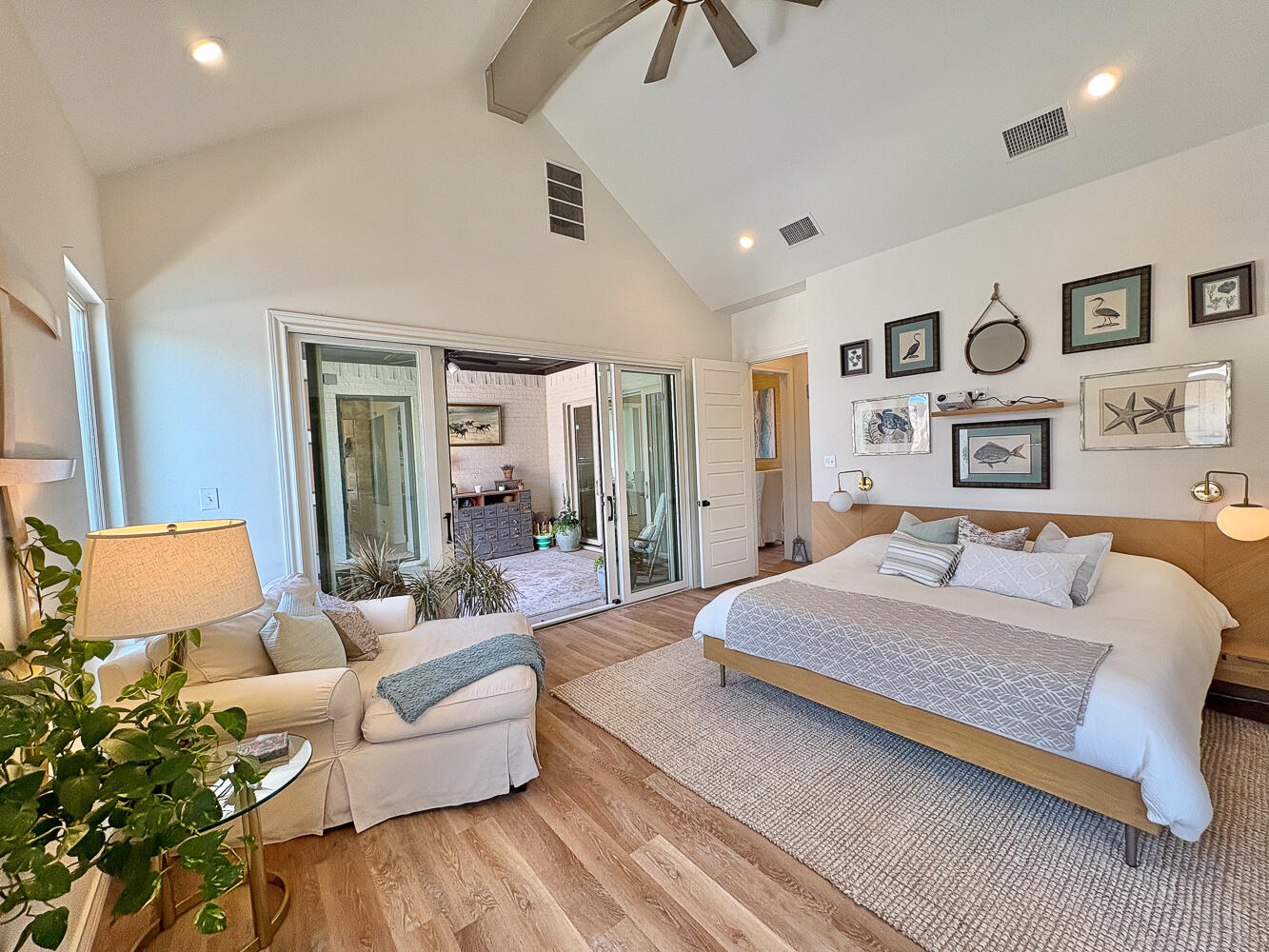 5902 112th Street Lubbock, TX 79424 - Photo 12 of 45 a bedroom with a large bed and a couch