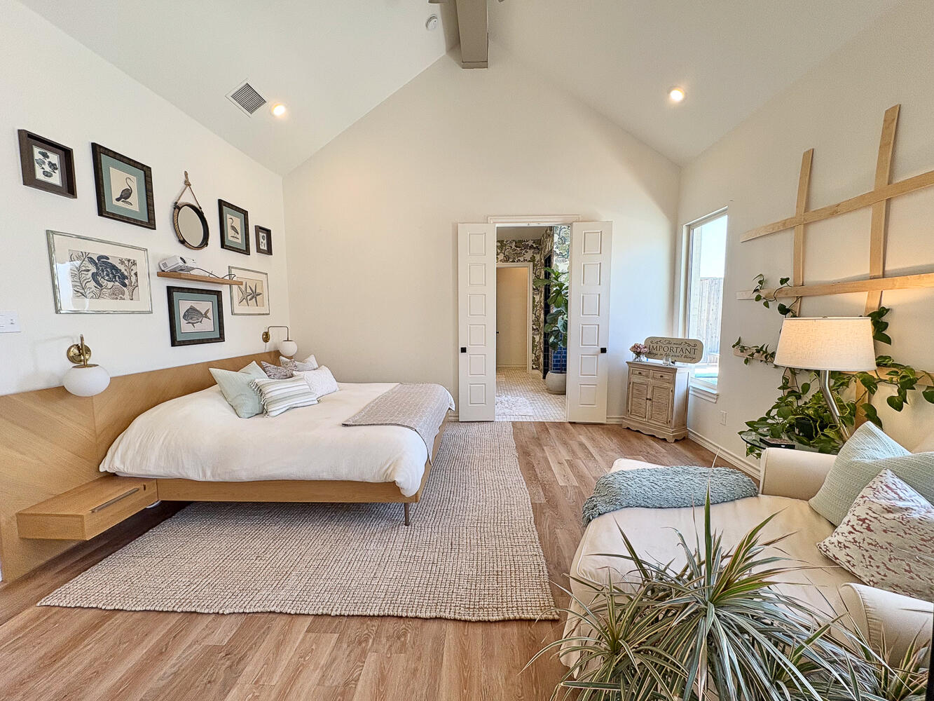 5902 112th Street Lubbock, TX 79424 - Photo 14 of 45 a bedroom with a large bed and a couch