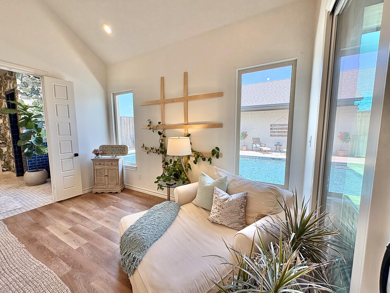 5902 112th Street Lubbock, TX 79424 - Photo 15 of 45 a bedroom with a large bed and a potted plant