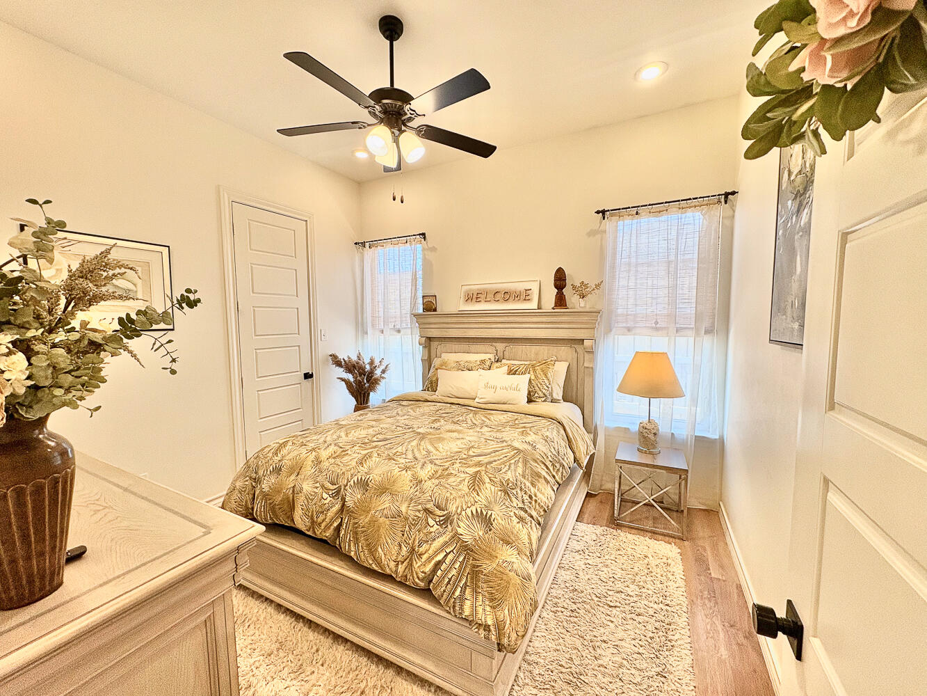 5902 112th Street Lubbock, TX 79424 - Photo 19 of 45 a bedroom with a bed and a chandelier