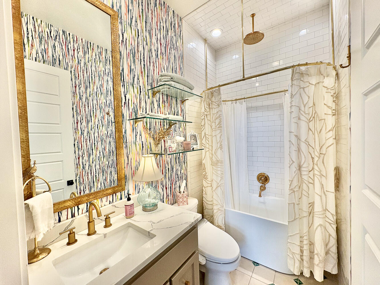 5902 112th Street Lubbock, TX 79424 - Photo 20 of 45 a bathroom with a sink toilet double vanity and shower