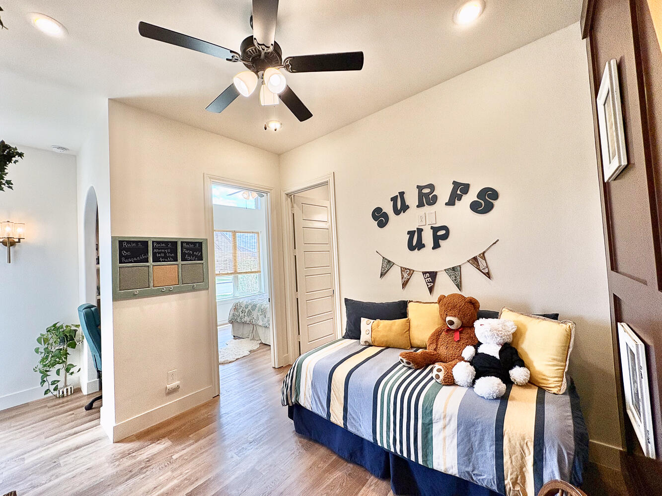 5902 112th Street Lubbock, TX 79424 - Photo 23 of 45 a bedroom with a bed and wooden floor