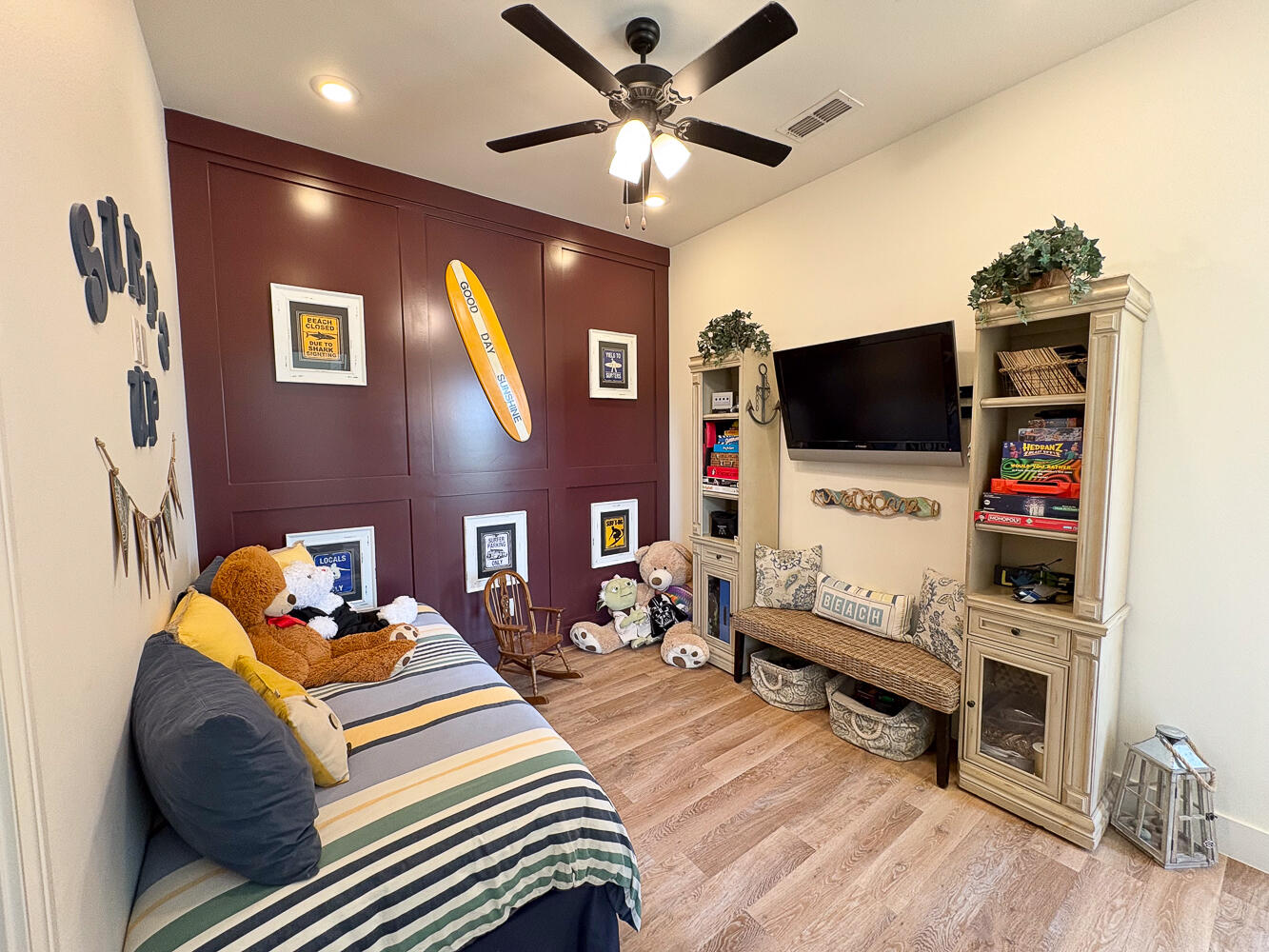 5902 112th Street Lubbock, TX 79424 - Photo 24 of 45 a bedroom with furniture and a flat screen tv