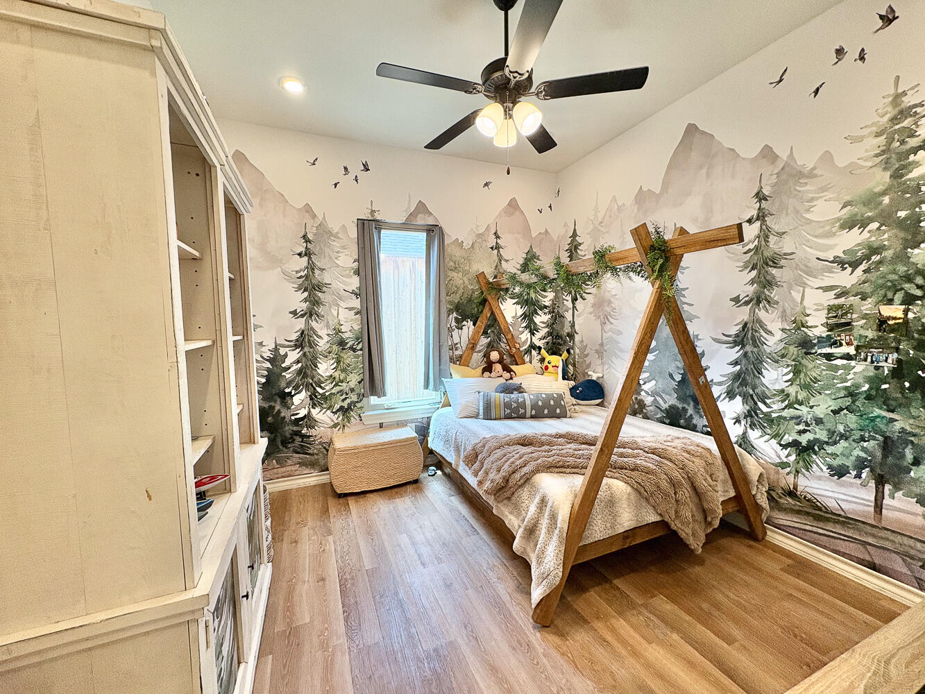 5902 112th Street Lubbock, TX 79424 - Photo 25 of 45 a bedroom with a bed and wooden floor