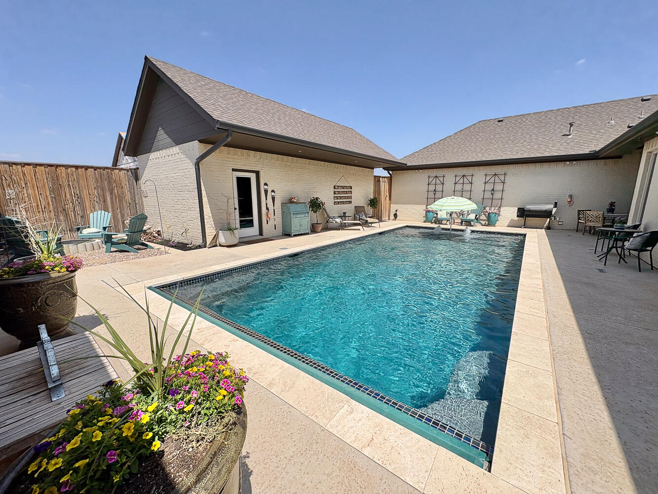 5902 112th Street Lubbock, TX 79424 - Photo 31 of 45 a front view of a house with garden