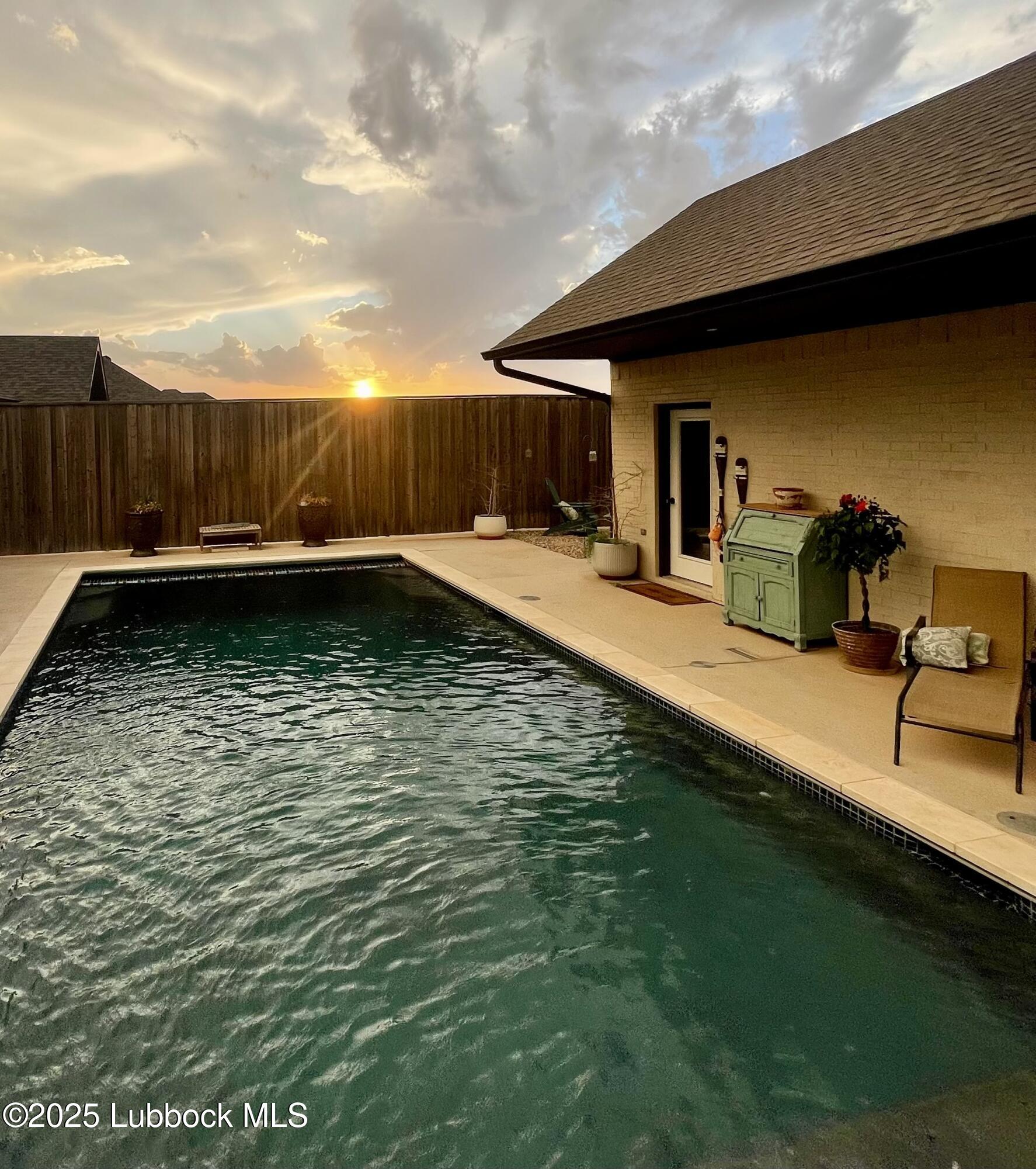 5902 112th Street Lubbock, TX 79424 - Photo 41 of 45 a swimming pool with outdoor seating