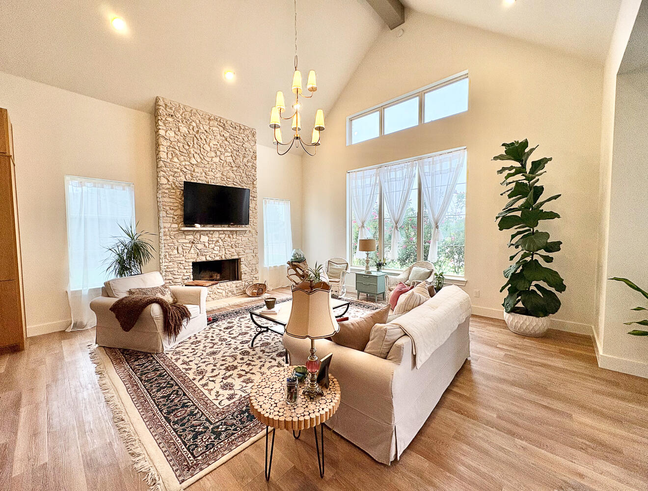 5902 112th Street Lubbock, TX 79424 - Photo 7 of 45 a living room with furniture a fireplace and a flat screen tv