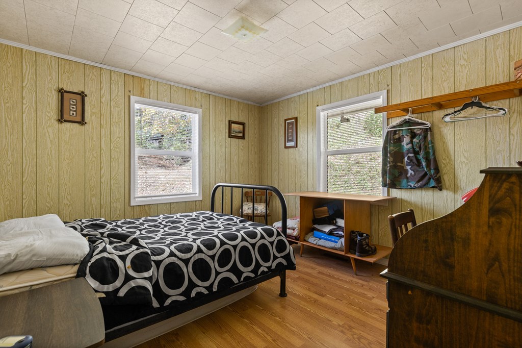 492 Johnny Gap Road Suches, GA 30572 - Photo 11 of 16 a bedroom with a bed and a window