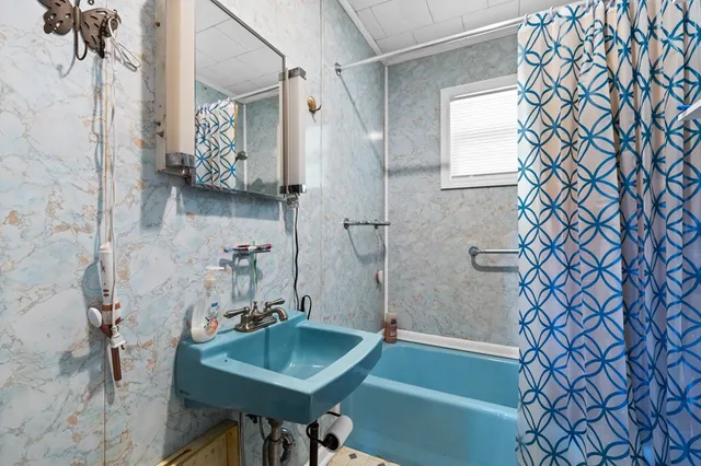 a bathroom with a sink and a shower