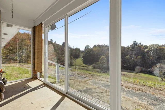 a view of a glass door and a window
