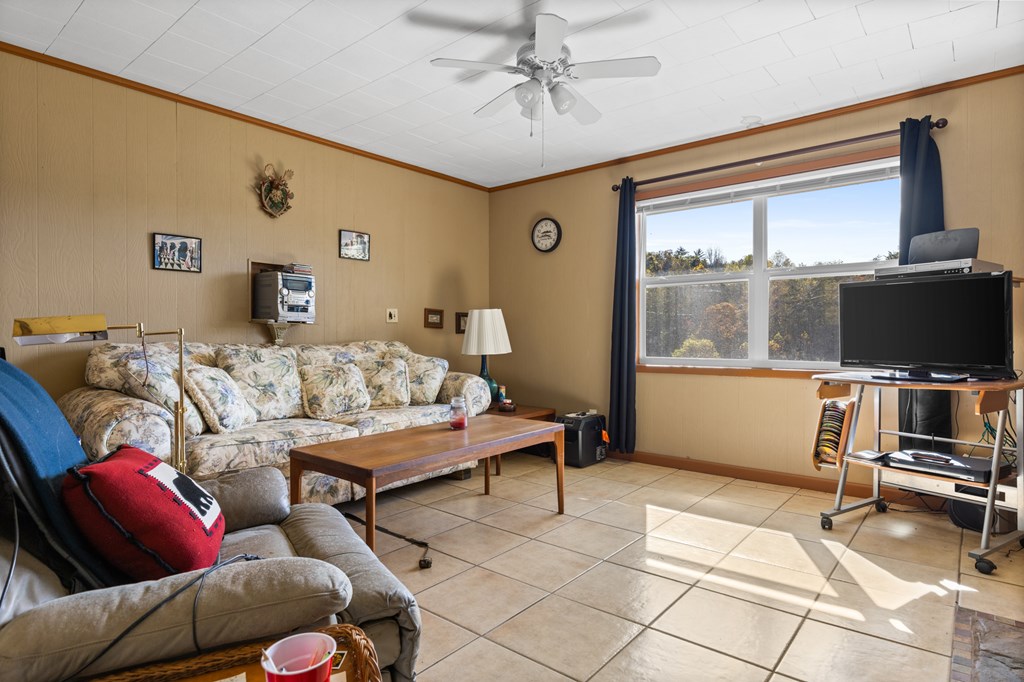 492 Johnny Gap Road Suches, GA 30572 - Photo 8 of 16 a living room with furniture and a flat screen tv