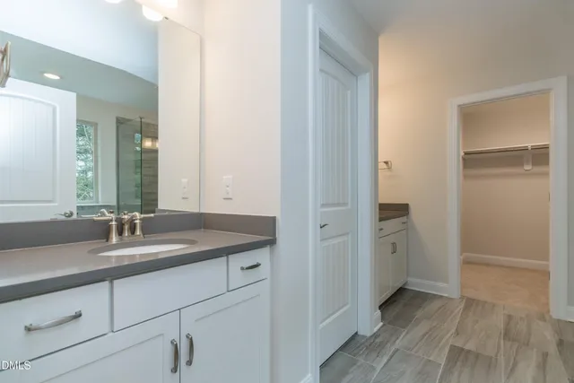 a bathroom with a bathtub and shower
