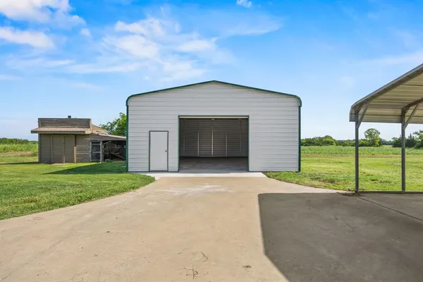 a front view of a house with garage