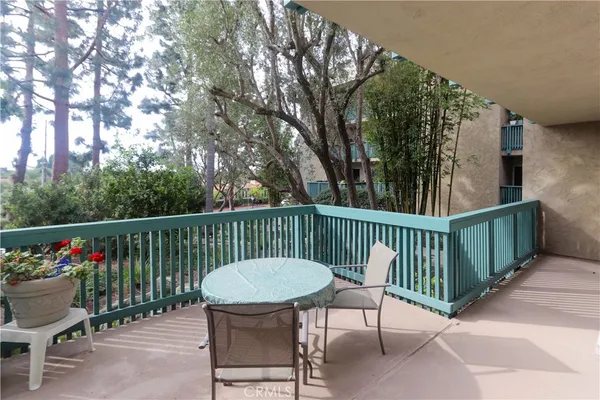 a view of a table and chairs in the balcony